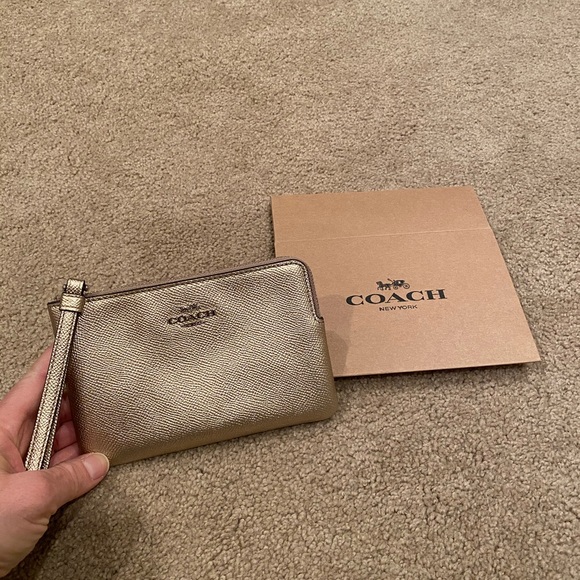 COACH Rose Gold wristlet NEW w tag & box 4”x 6”